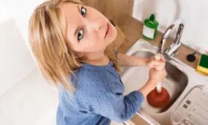 Woman using plunger