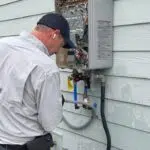 Plumber Fixing Water Heater