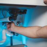 Plumber Checking Drain