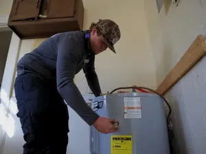 Plumber-working-on-a- water-heater