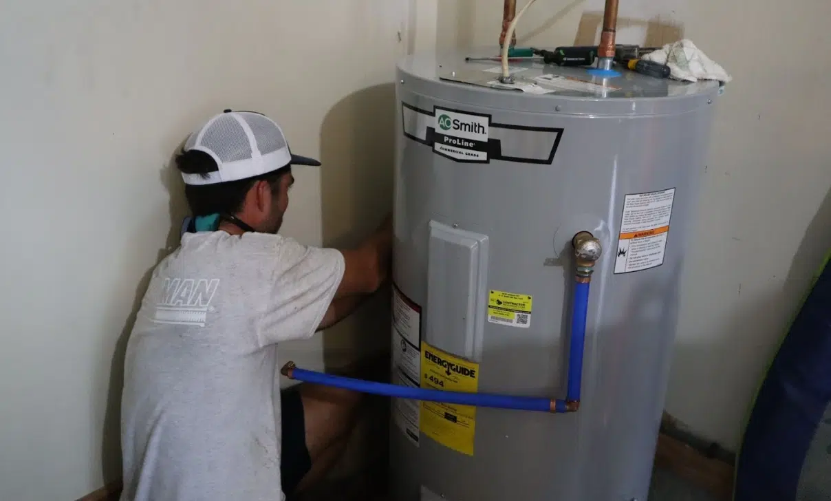 Plumber Checking Water Heater