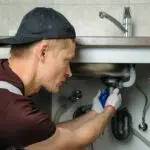 Plumber doing repair