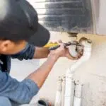 Plumber Fixing Pipe