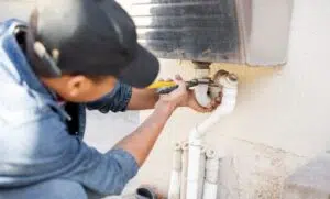 Plumber Fixing Pipe