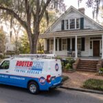 Rooter Man van parked outside old home