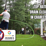 Rooter Man Plumbing technician performing drain cleaning in Charleston with a 5.0-star Google rating graphic and “Top-Rated Drain Cleaning in Charleston” text.